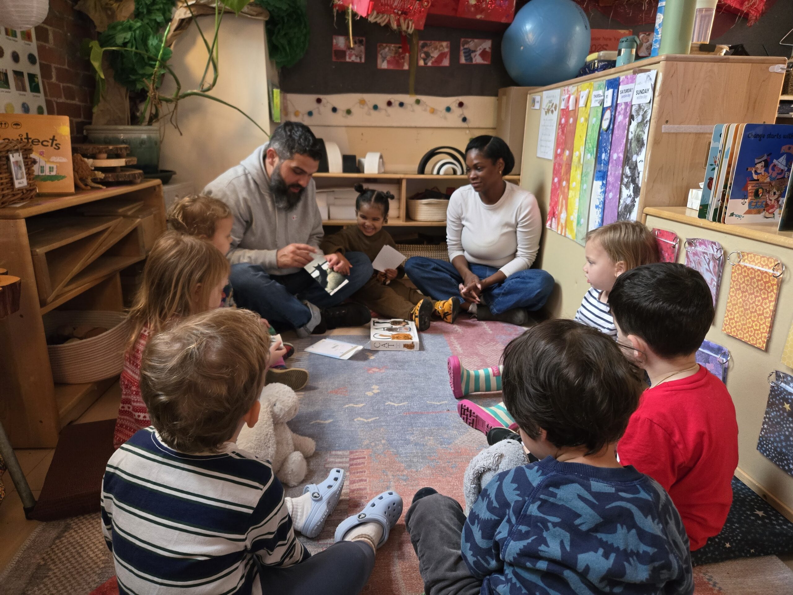 students and teachers sitting in a circle