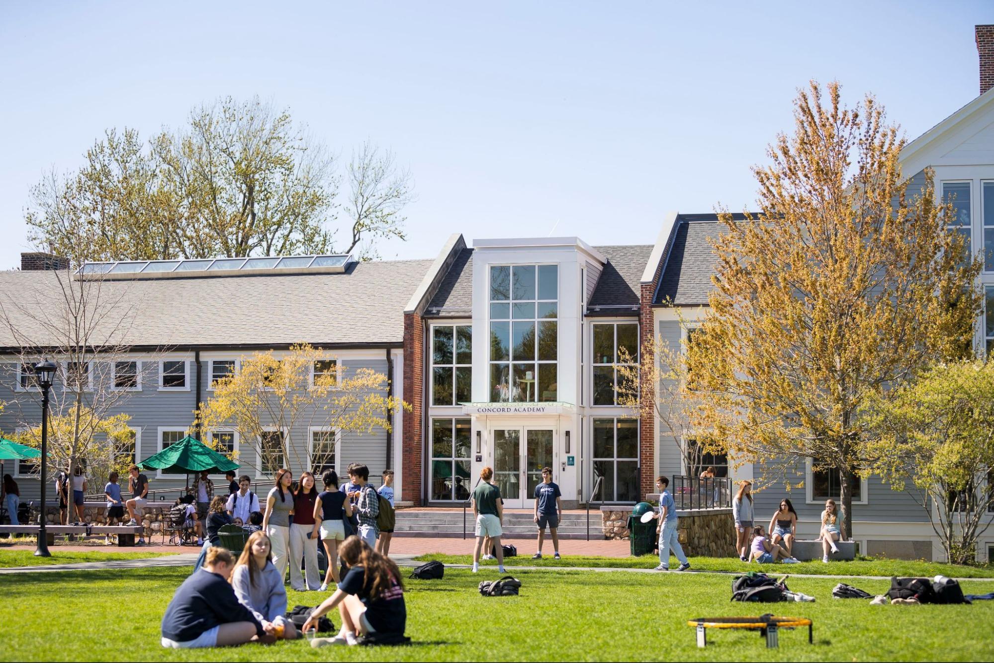 students in front of main lawn